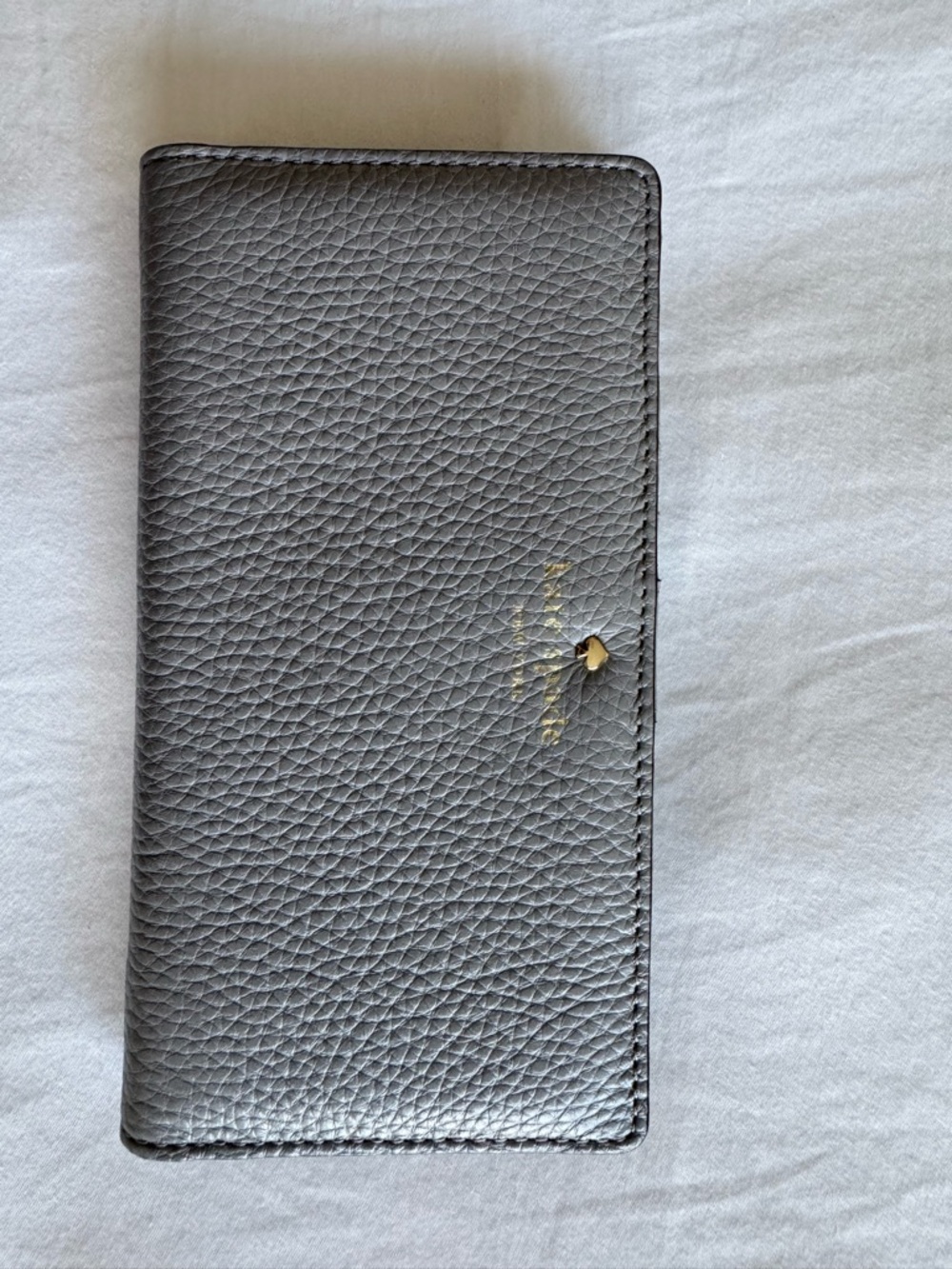 kate spade gray pebbled leather continental wallet with gold logo